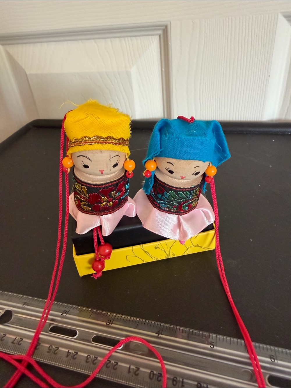 Vintage Asian souvenir spool/peg dolls. Dangle legs. Long hanging string